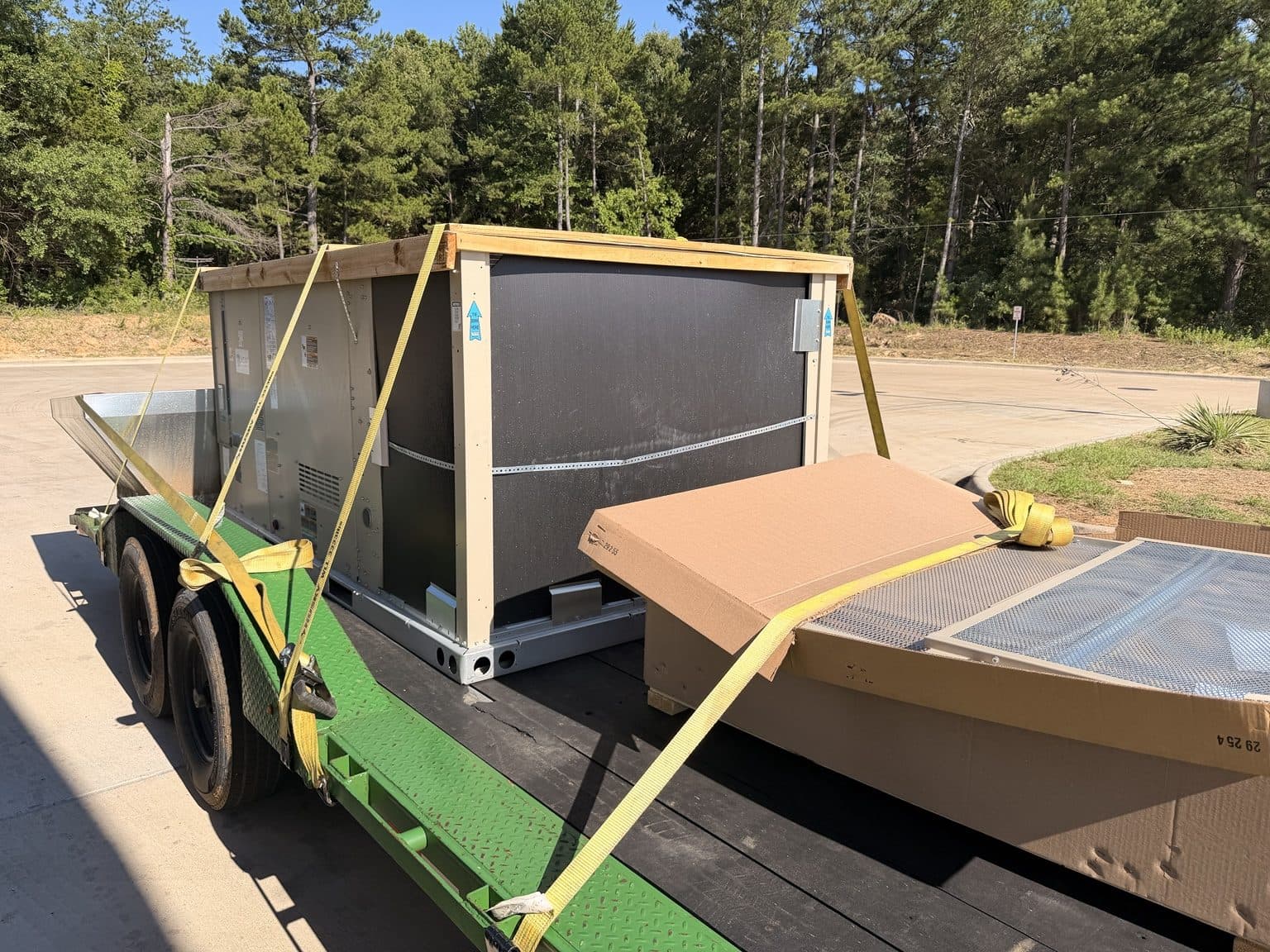 Commercial rooftop HVAC package unit staged on a delivery trailer