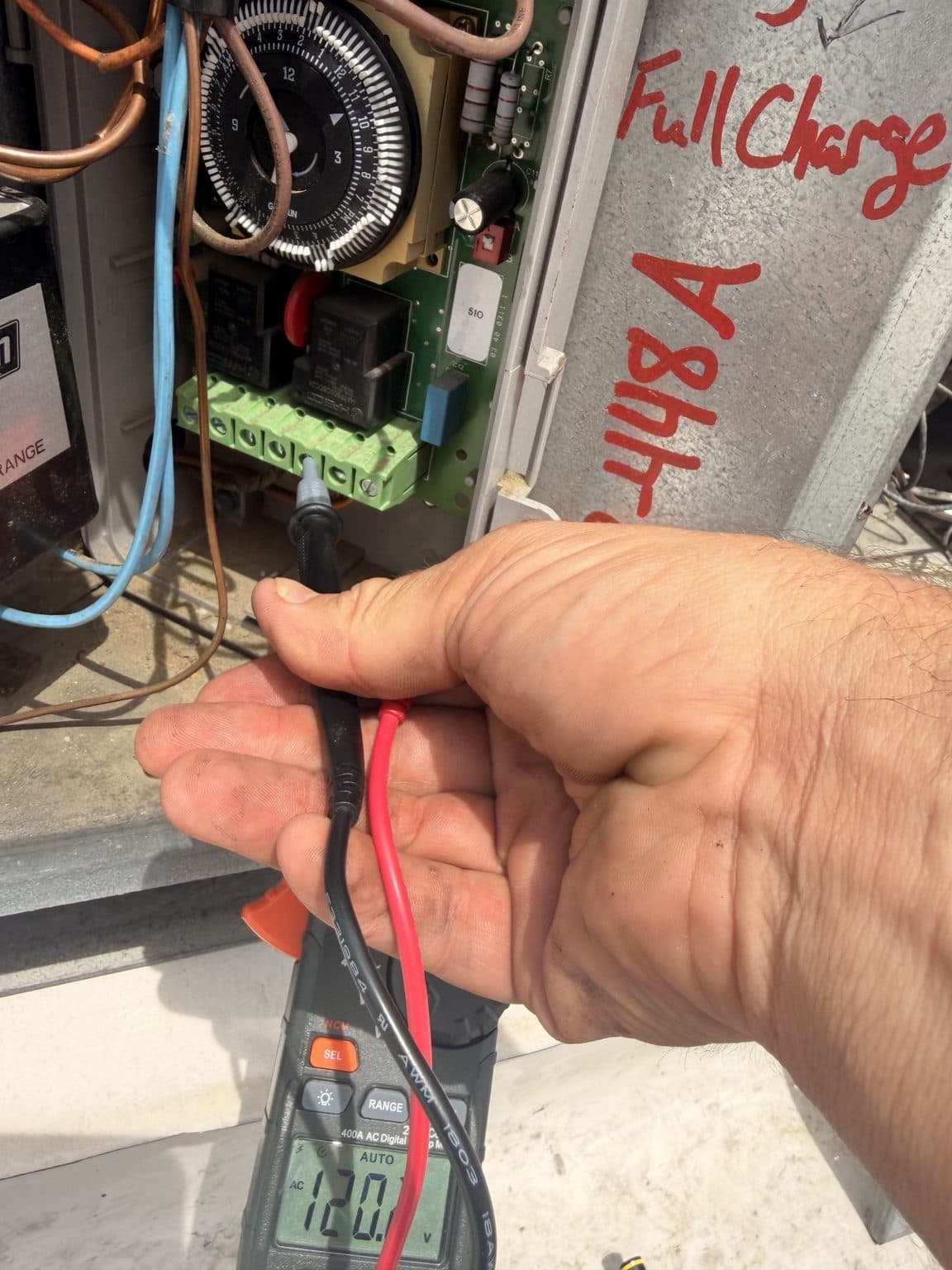 Testing a reach-in cooler's timer-clock control during repair