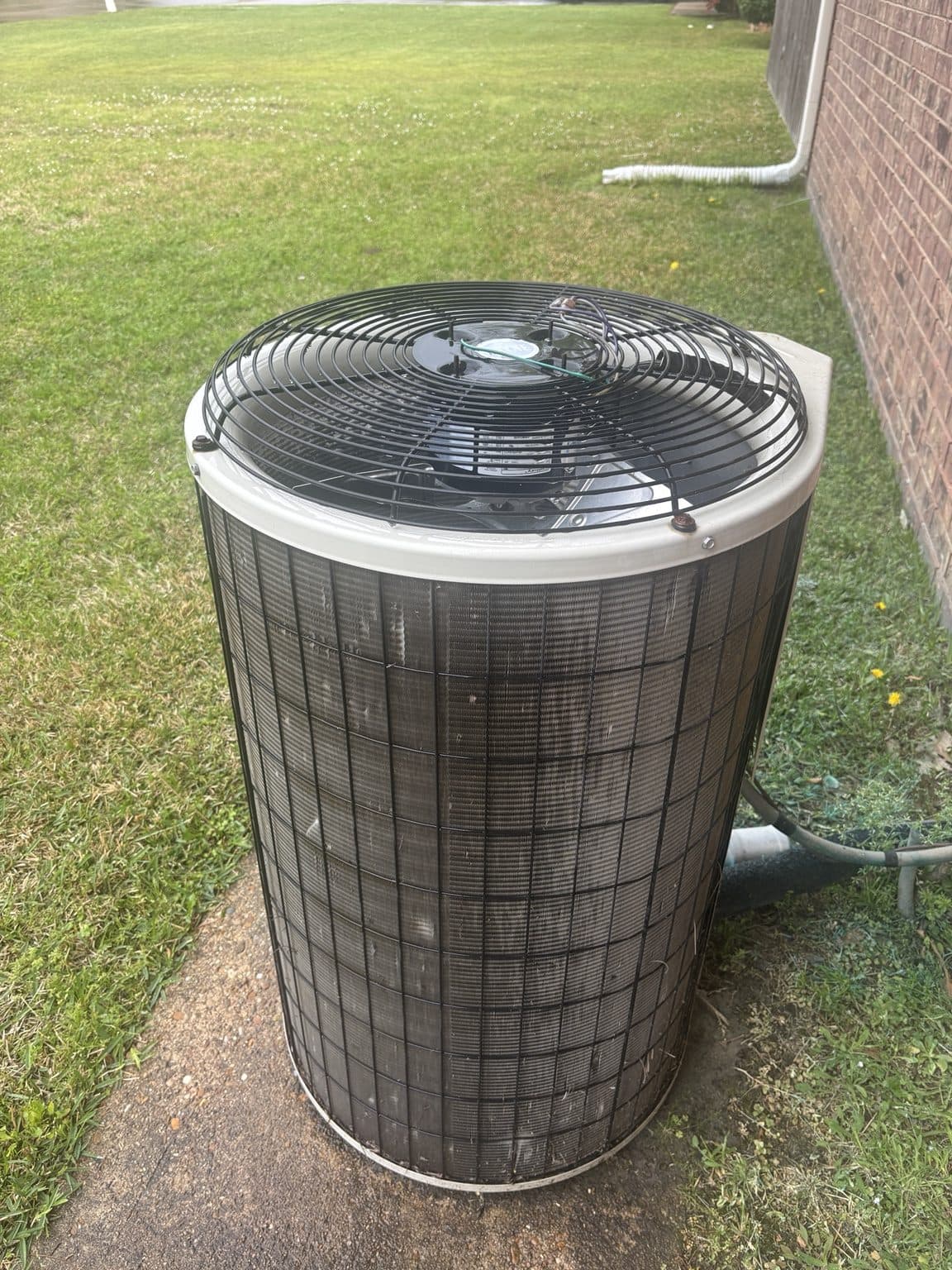 Residential outdoor condenser unit in daylight