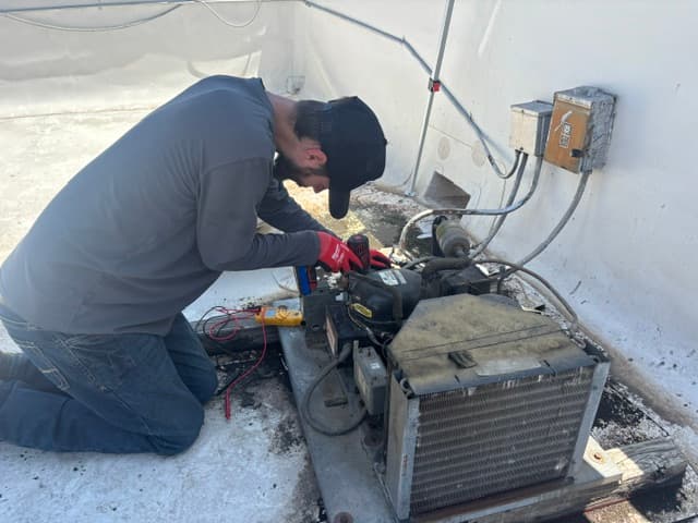 Repair It Guys technician performing preventive maintenance